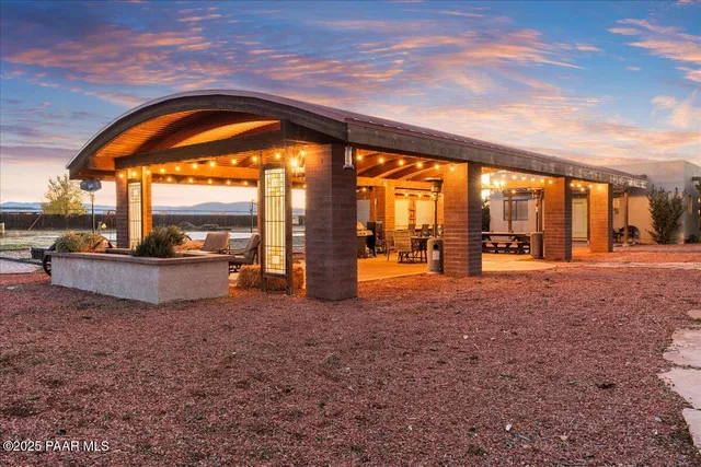 a kitchen with stainless steel appliances granite countertop a refrigerator a stove and a sink