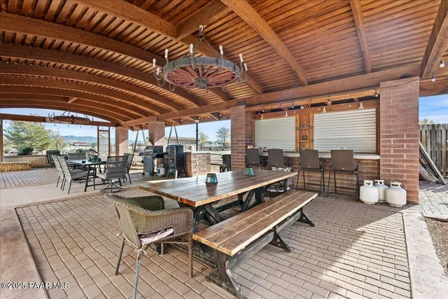 a living room with furniture a window and flat screen tv