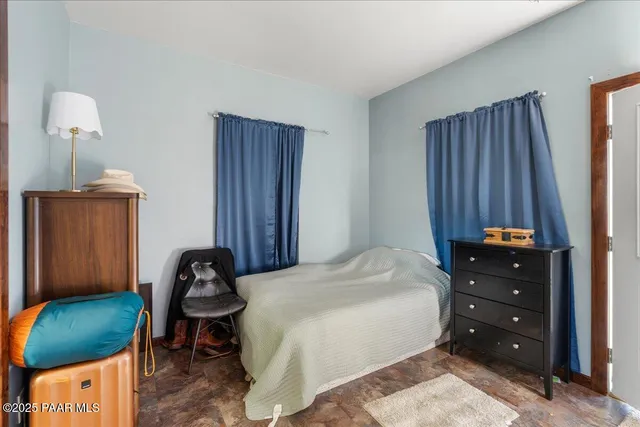 a view of a terrace with a table and chairs