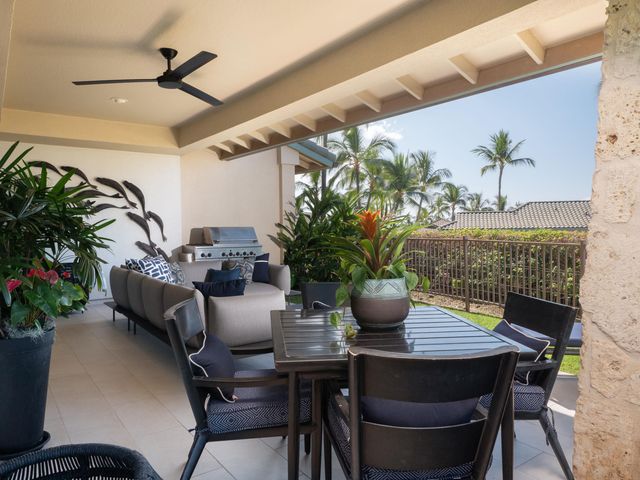 a outdoor living space with furniture and a potted plant