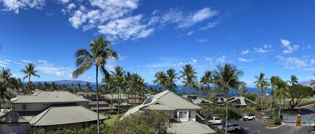 a bed room with a bed and a potted plant