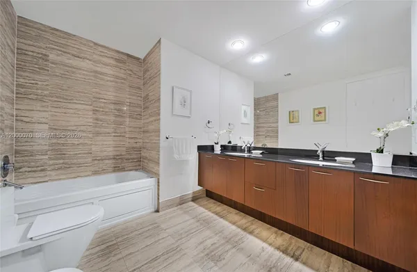 a bathroom with a shower and a sink