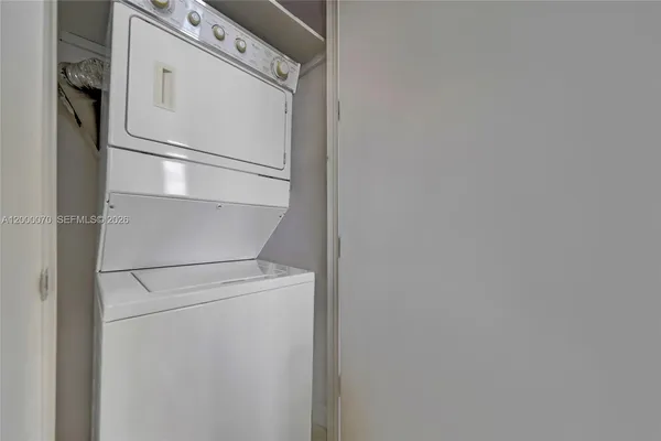 a white refrigerator freezer and a dishwasher
