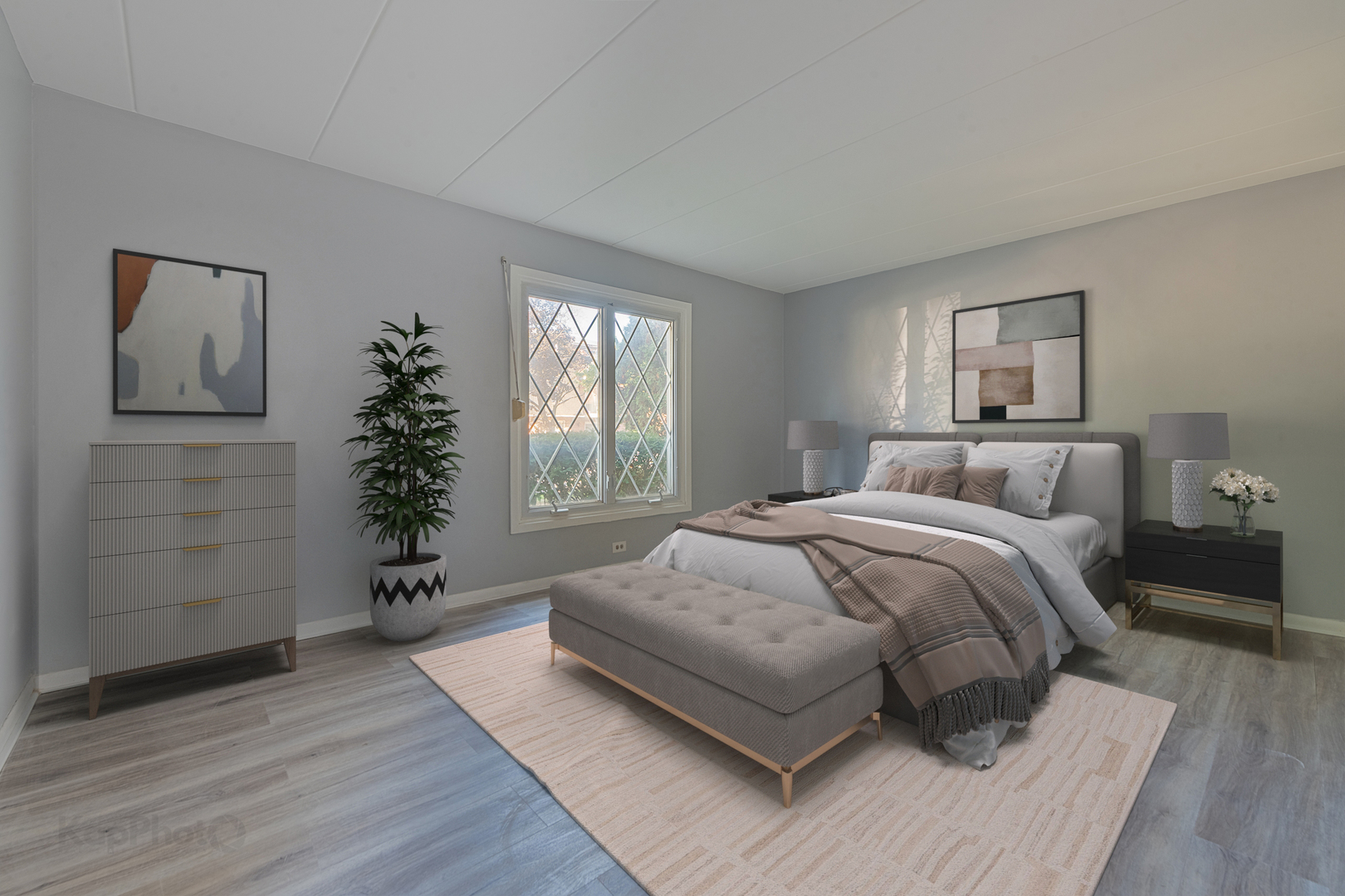 669 Chappel Avenue, Unit 1A Calumet City, IL 60409 - Photo 14 of 24 a bedroom with a large bed and a potted plant