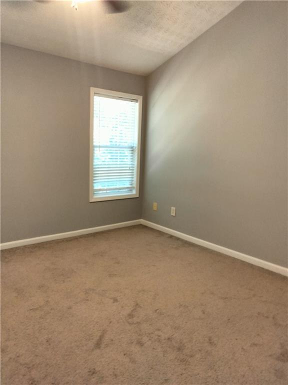 3299 Hampton Green Way Atlanta, GA 30340 - Photo 14 of 22 an empty room with a window