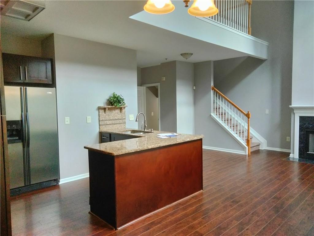 3299 Hampton Green Way Atlanta, GA 30340 - Photo 6 of 22 a kitchen with stainless steel appliances granite countertop a stove and a refrigerator