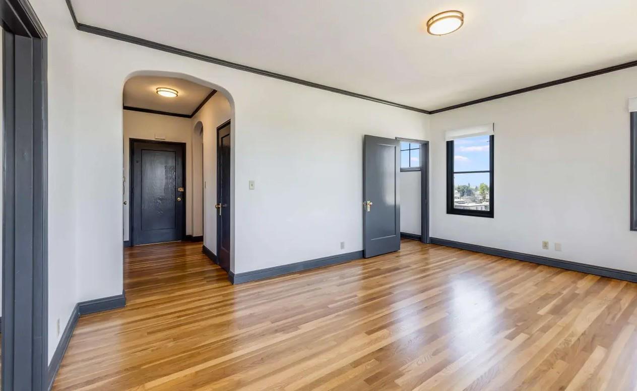 3719 Emerson Street Oakland, CA 94610 - Photo 11 of 34 a view of a livingroom with wooden floor and window