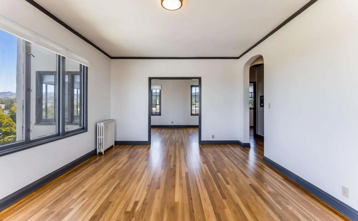 3719 Emerson Street Oakland, CA 94610 - Photo 15 of 34 a view of a room with wooden floor and gate