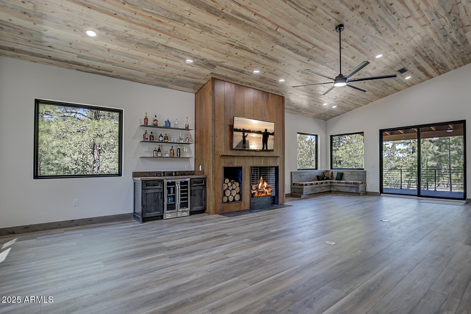 2965 Eagle Ridge Circle Happy Jack, AZ 86024 - Photo 14 of 54 a view of a livingroom with fireplace window and wooden floor
