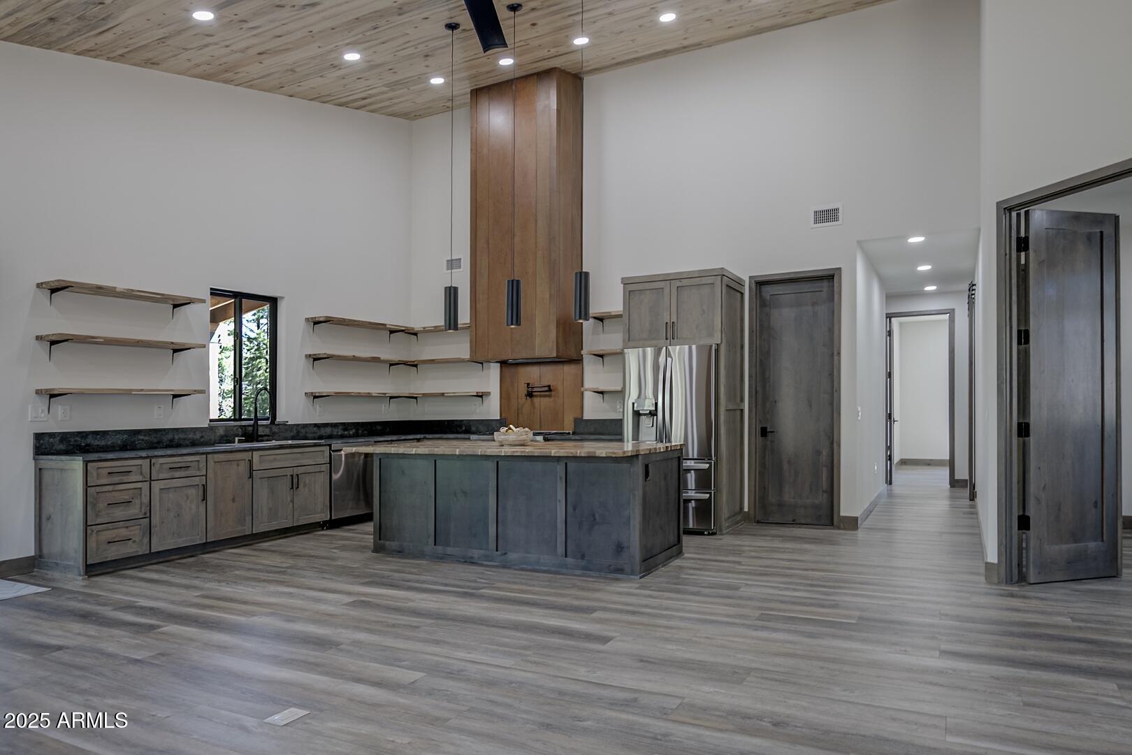 2965 Eagle Ridge Circle Happy Jack, AZ 86024 - Photo 18 of 54 a large kitchen with a lot of counter space and stainless steel appliances