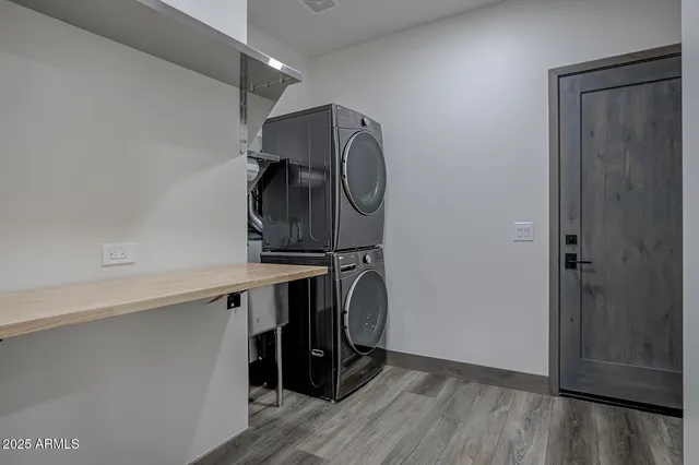 a bathroom with a double vanity sink toilet and shower