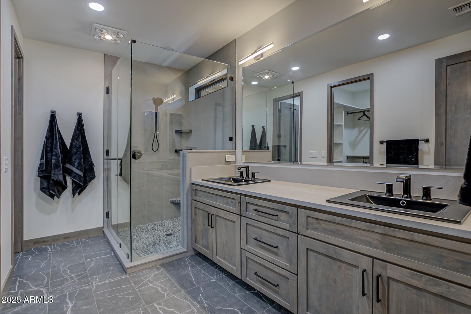 2965 Eagle Ridge Circle Happy Jack, AZ 86024 - Photo 32 of 54 a spacious bathroom with a double vanity sink and mirror
