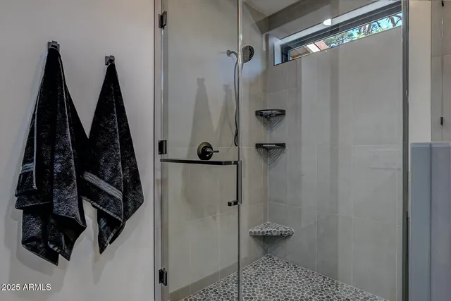 a view of a house with a backyard porch and sitting area