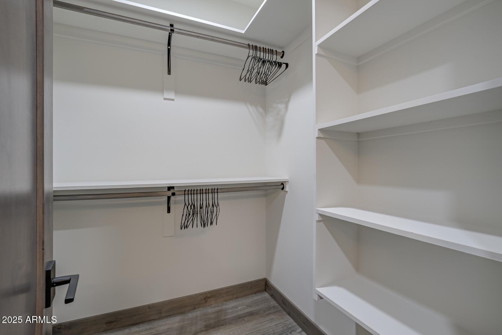 2965 Eagle Ridge Circle Happy Jack, AZ 86024 - Photo 34 of 54 a view of walk in closet with empty racks