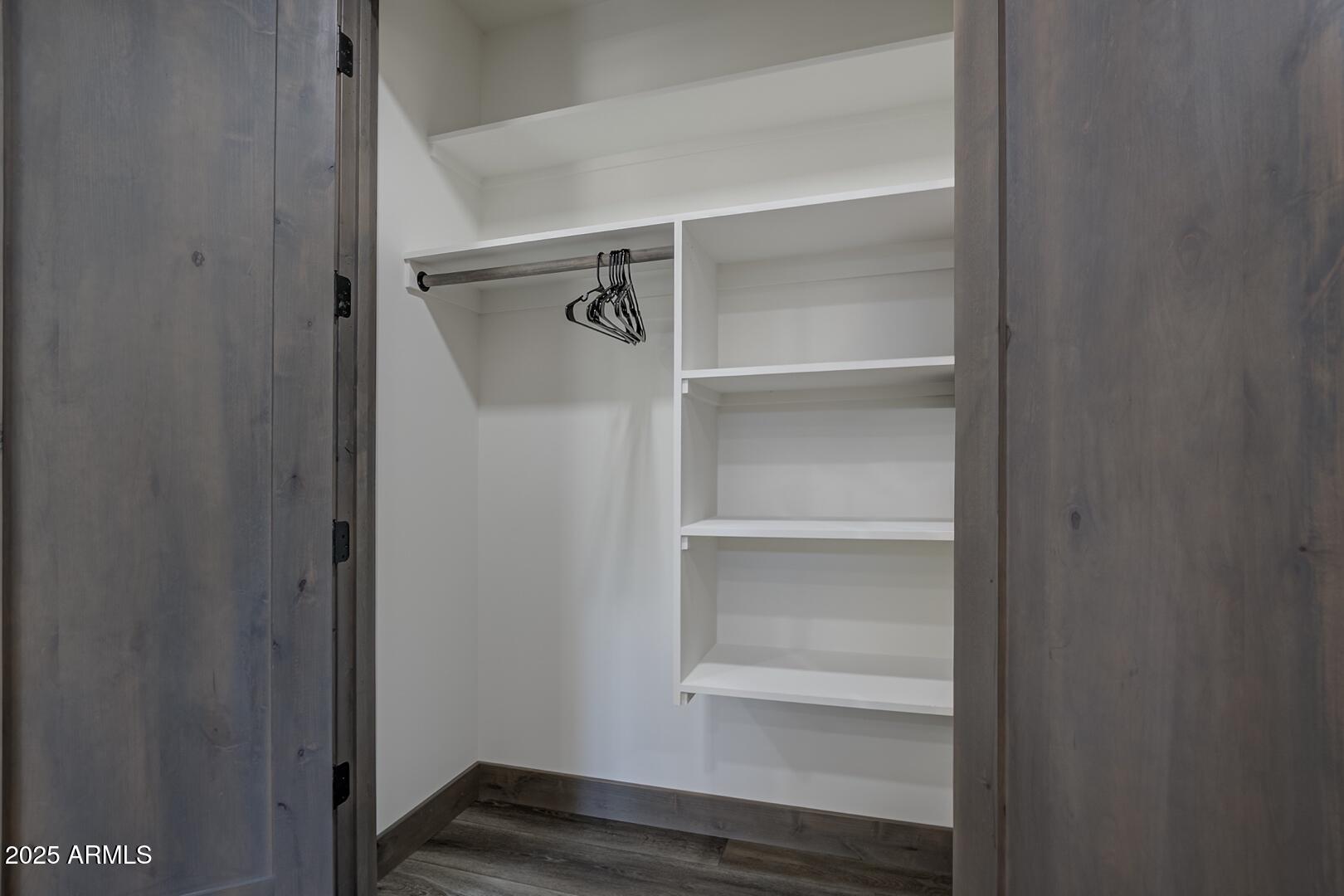 2965 Eagle Ridge Circle Happy Jack, AZ 86024 - Photo 36 of 54 a view of walk in closet with empty racks