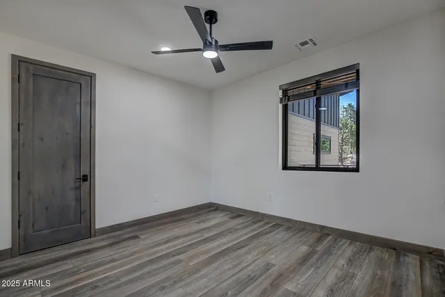 a view of a city with lush green forest