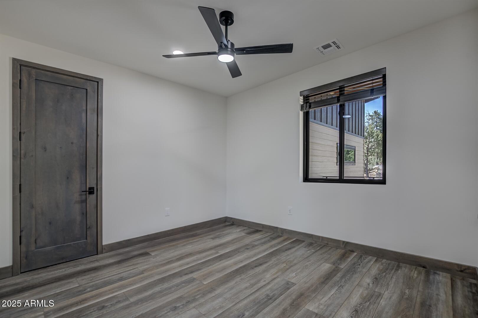 2965 Eagle Ridge Circle Happy Jack, AZ 86024 - Photo 37 of 54 wooden floor in an empty room
