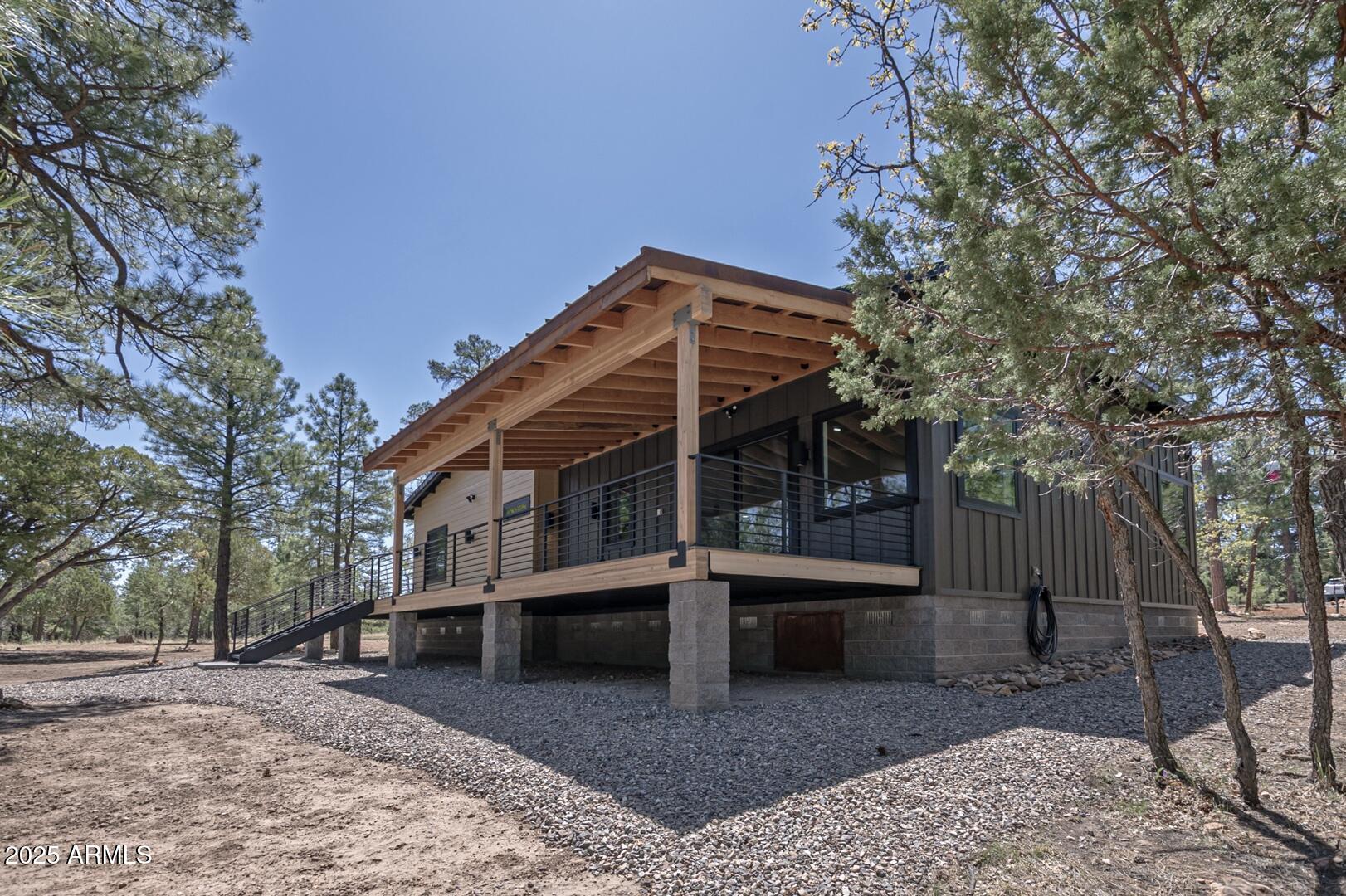 2965 Eagle Ridge Circle Happy Jack, AZ 86024 - Photo 45 of 54 a view of a house with a yard