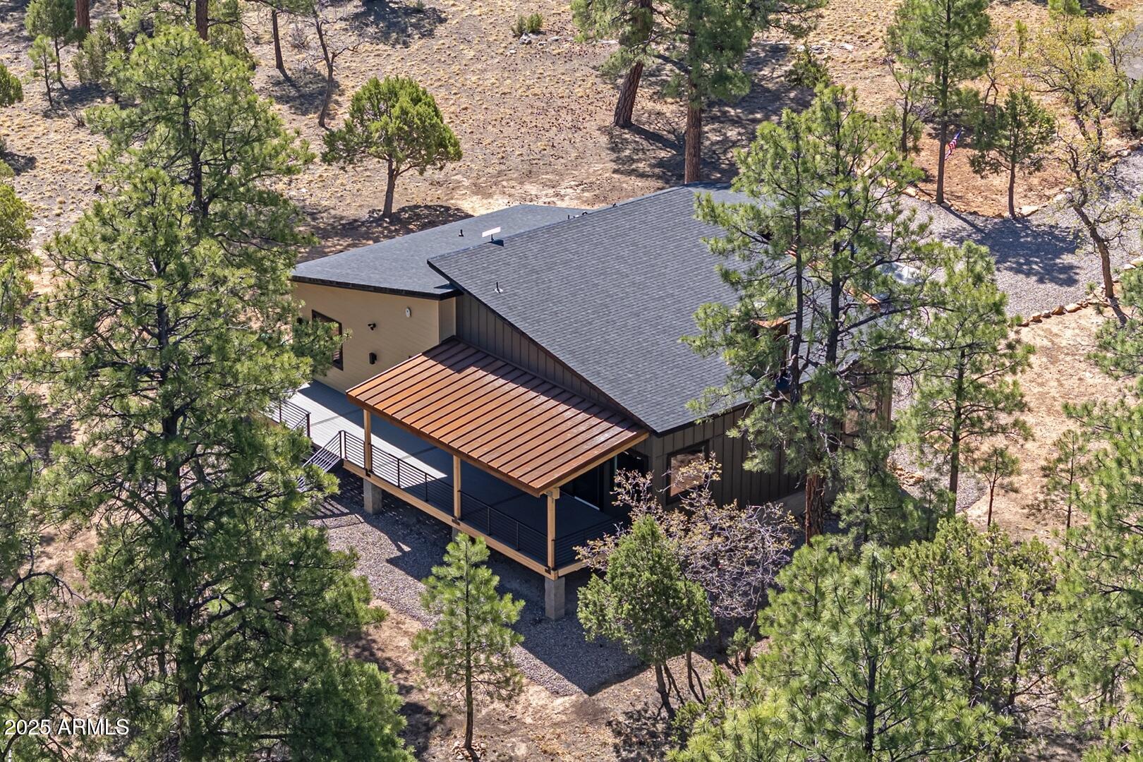 2965 Eagle Ridge Circle Happy Jack, AZ 86024 - Photo 49 of 54 an aerial view of a house with a garden