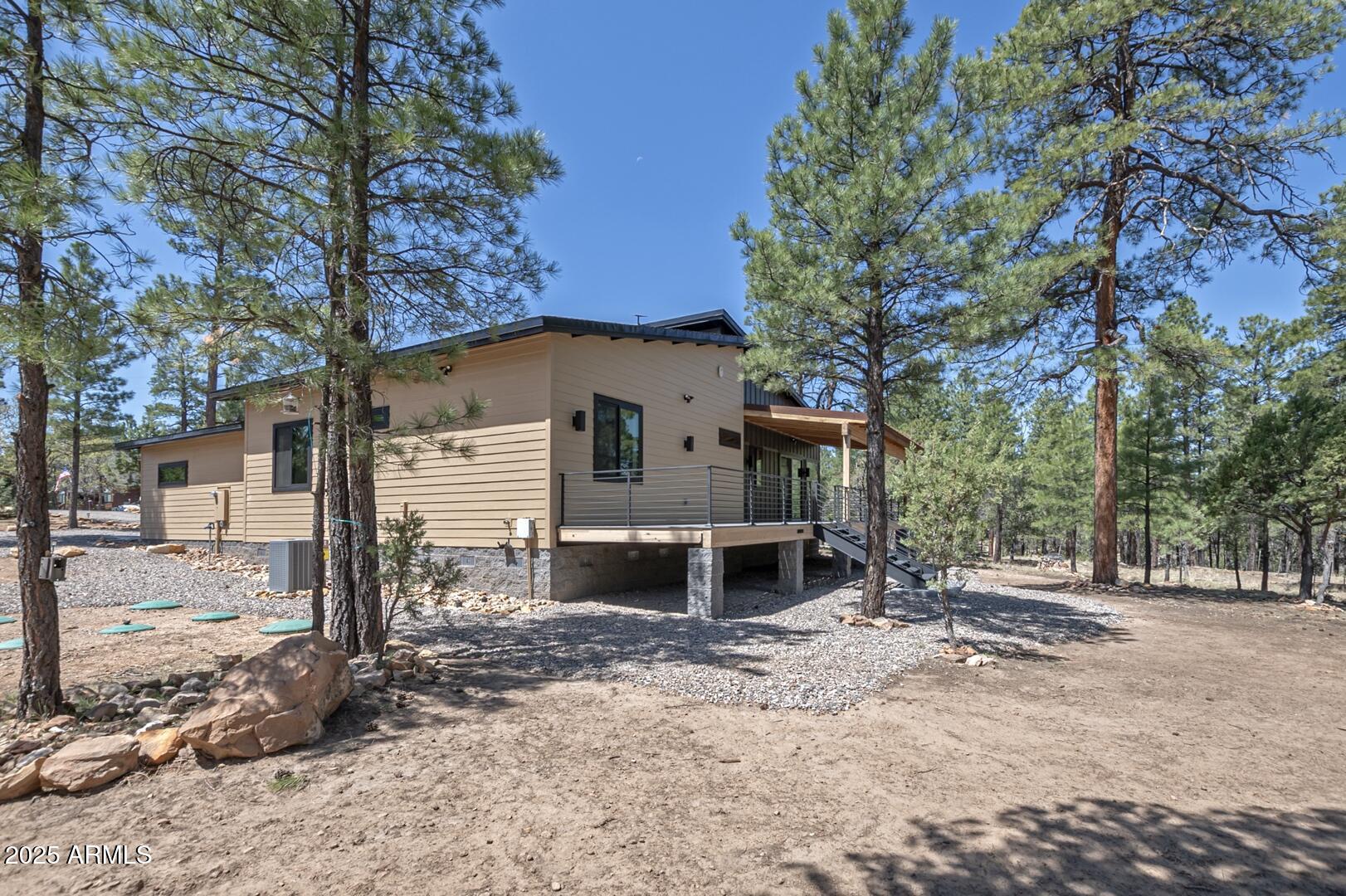 2965 Eagle Ridge Circle Happy Jack, AZ 86024 - Photo 5 of 54 a view of a house with a yard