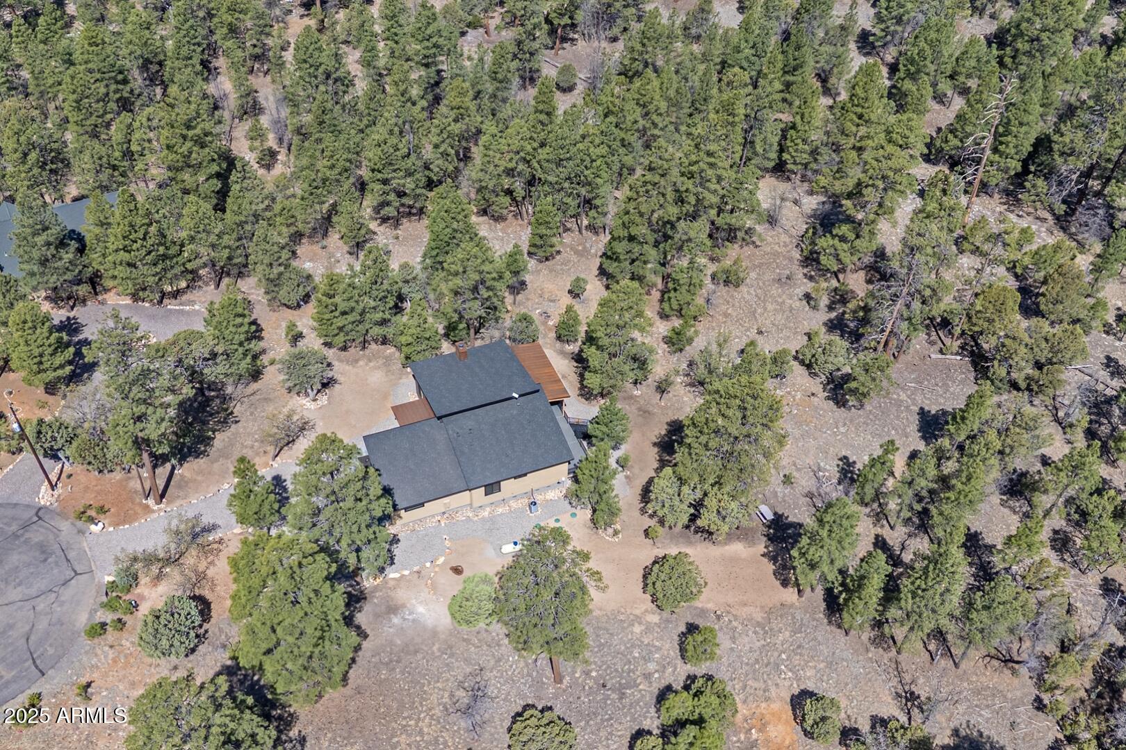 2965 Eagle Ridge Circle Happy Jack, AZ 86024 - Photo 51 of 54 an aerial view of a house with a yard