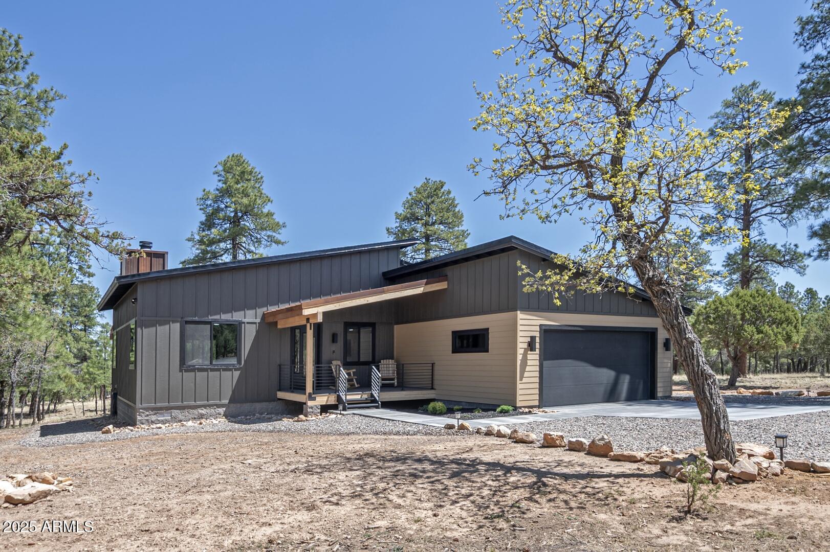 2965 Eagle Ridge Circle Happy Jack, AZ 86024 - Photo 7 of 54 a view of a house with a tree in front of it