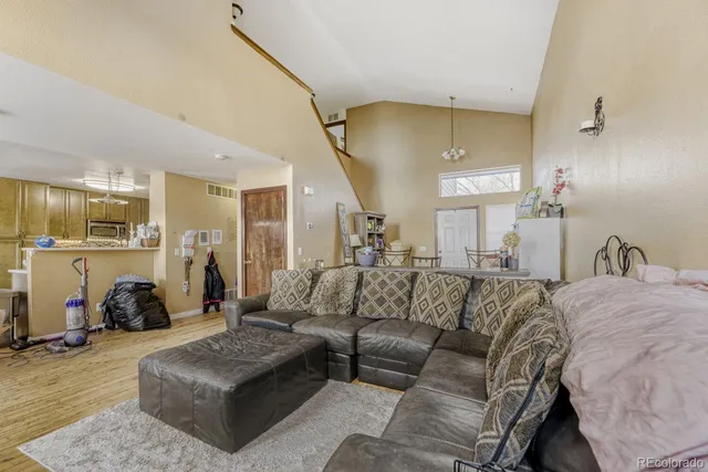 a view of living room kitchen and a couch
