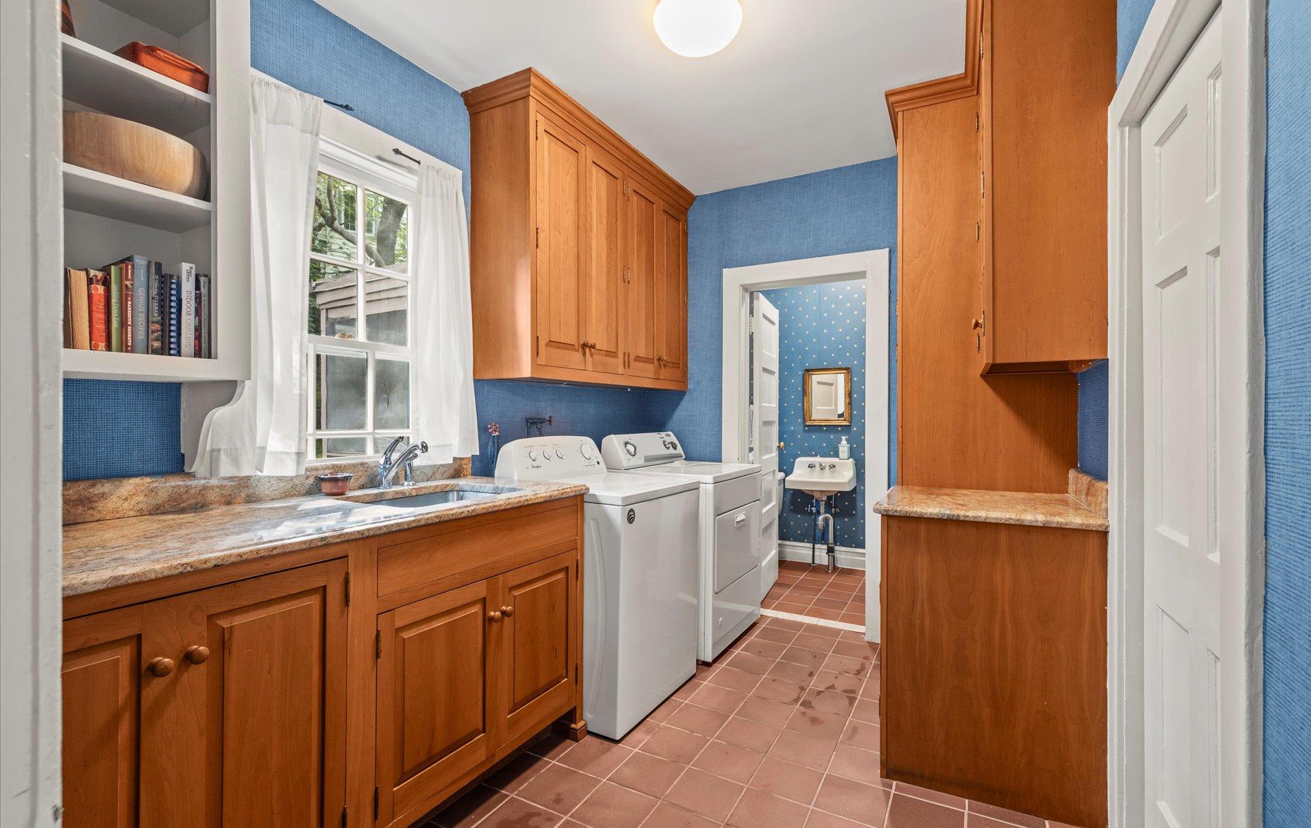 101 Forest Road Queens, NY 11363 - Photo 12 of 50 a utility room with a sink washer and dryer