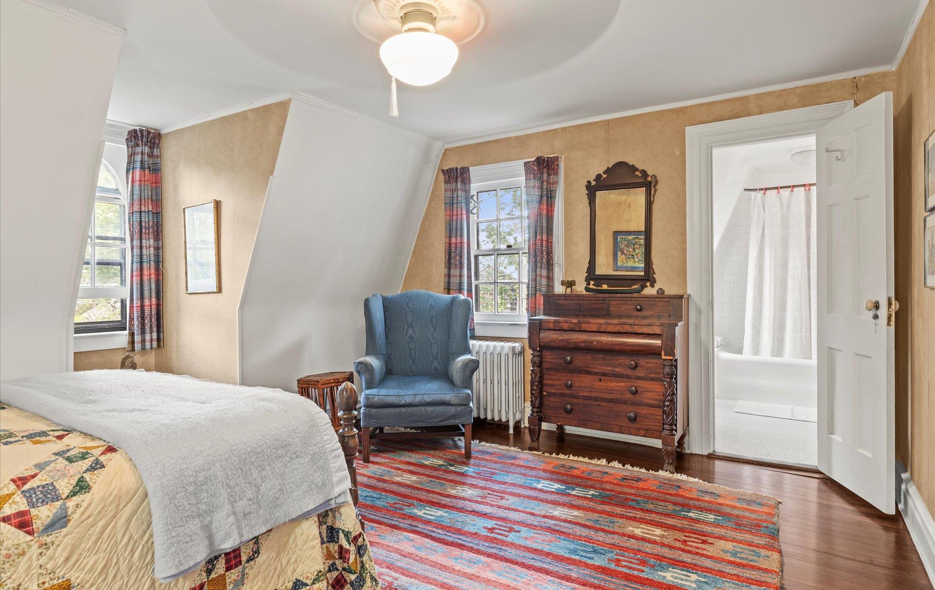 101 Forest Road Queens, NY 11363 - Photo 19 of 50 a bedroom with a bed and wooden floor