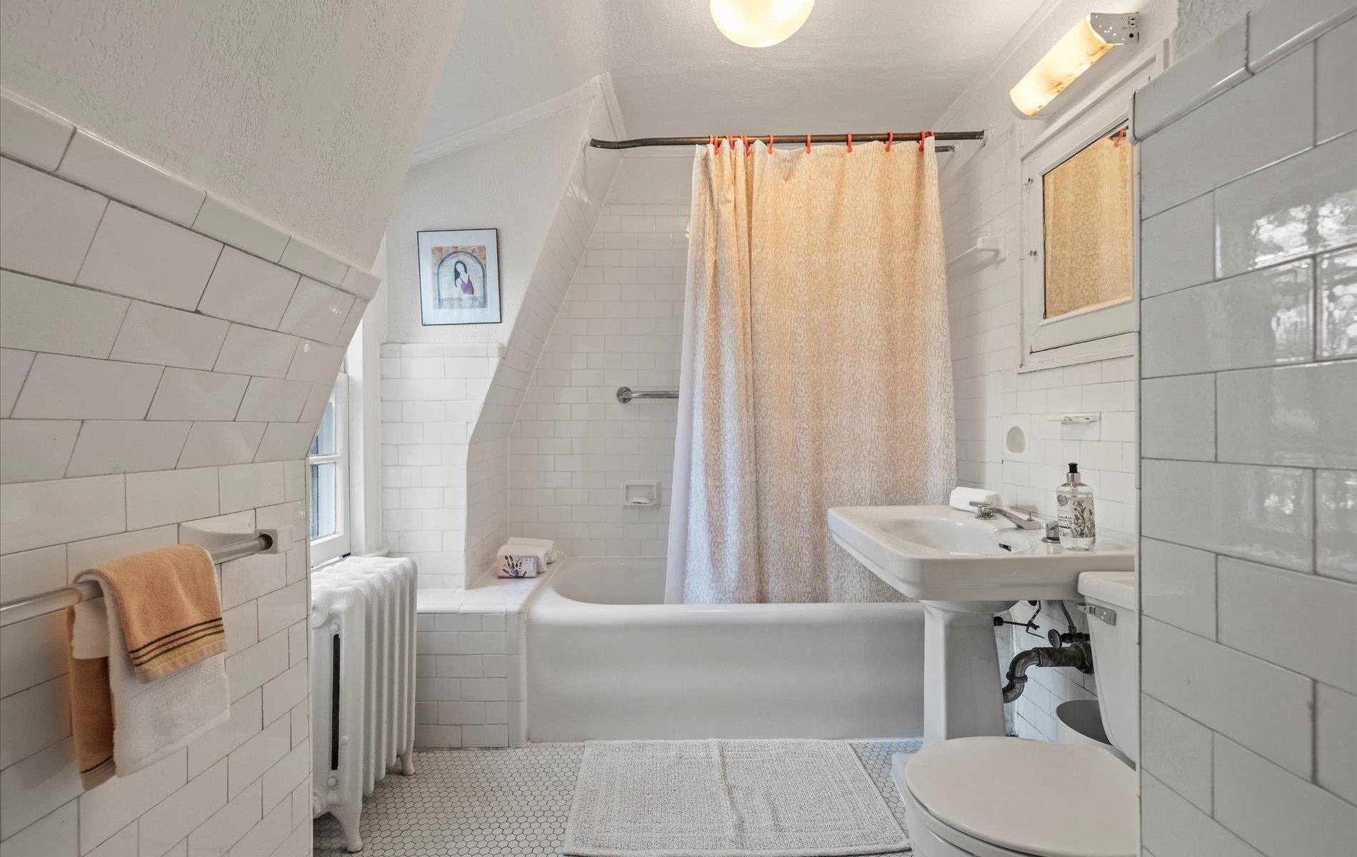 101 Forest Road Queens, NY 11363 - Photo 20 of 50 a bathroom with a sink a toilet and tub