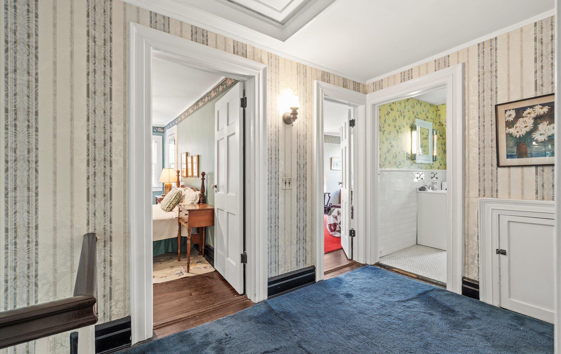 101 Forest Road Queens, NY 11363 - Photo 26 of 50 a view of a hallway with bathroom and wooden floor