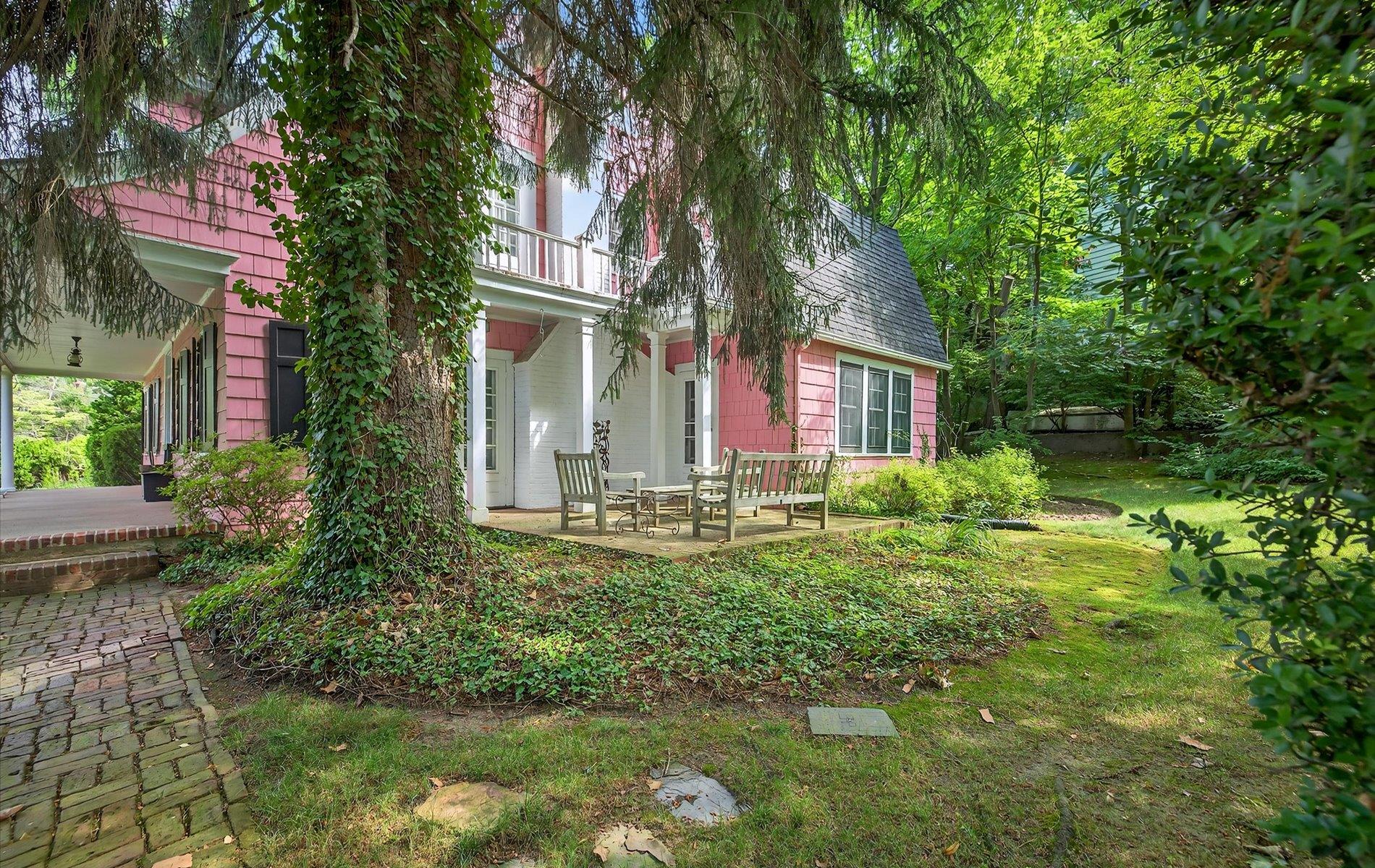 101 Forest Road Queens, NY 11363 - Photo 36 of 50 a front view of a house with garden