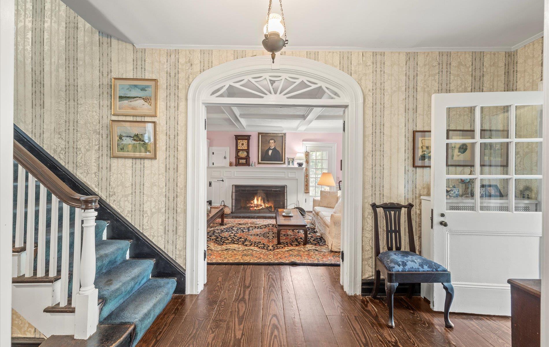 101 Forest Road Queens, NY 11363 - Photo 4 of 50 a view of a hallway with wooden floor and staircase