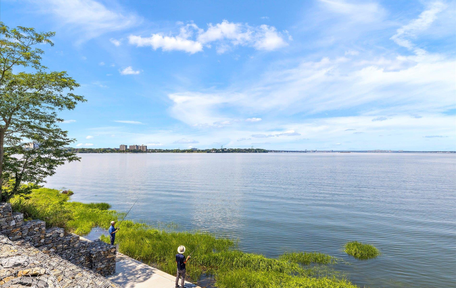 101 Forest Road Queens, NY 11363 - Photo 45 of 50 a view of a lake from a yard