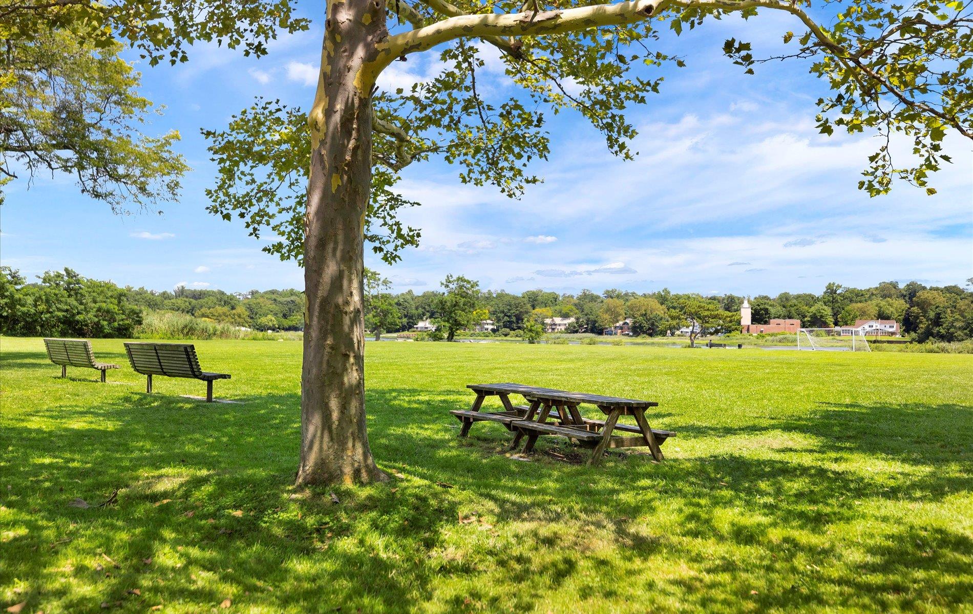 101 Forest Road Queens, NY 11363 - Photo 48 of 50 a view of a lake with a big yard