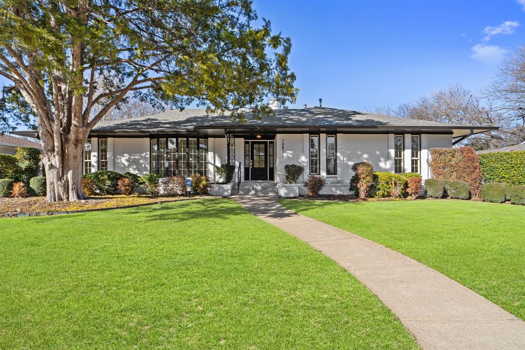 a front view of a building with outdoor seating