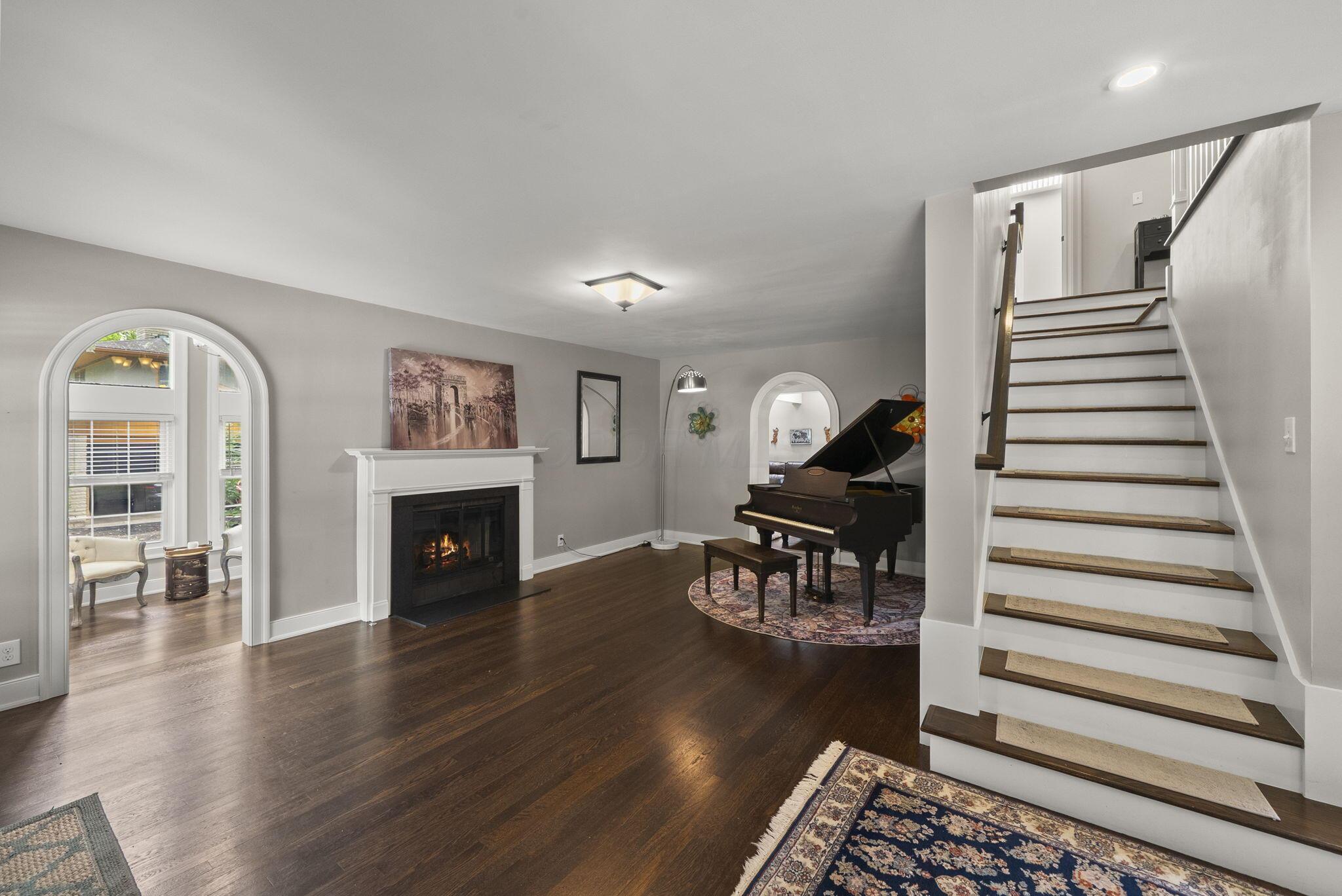 1851 Berkshire Road Columbus, OH 43221 - Photo 2 of 125 Home opens up to a beautiful fireplace and formal sitting room and current piano room.