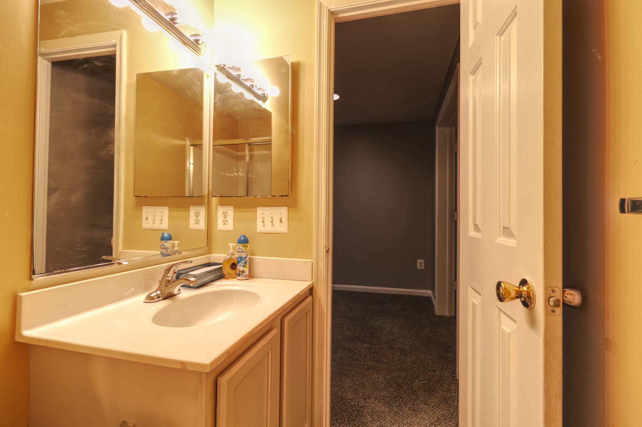 215 Seamaster Road Essex, MD 21221 - Photo 32 of 40 a bathroom with a sink and a mirror