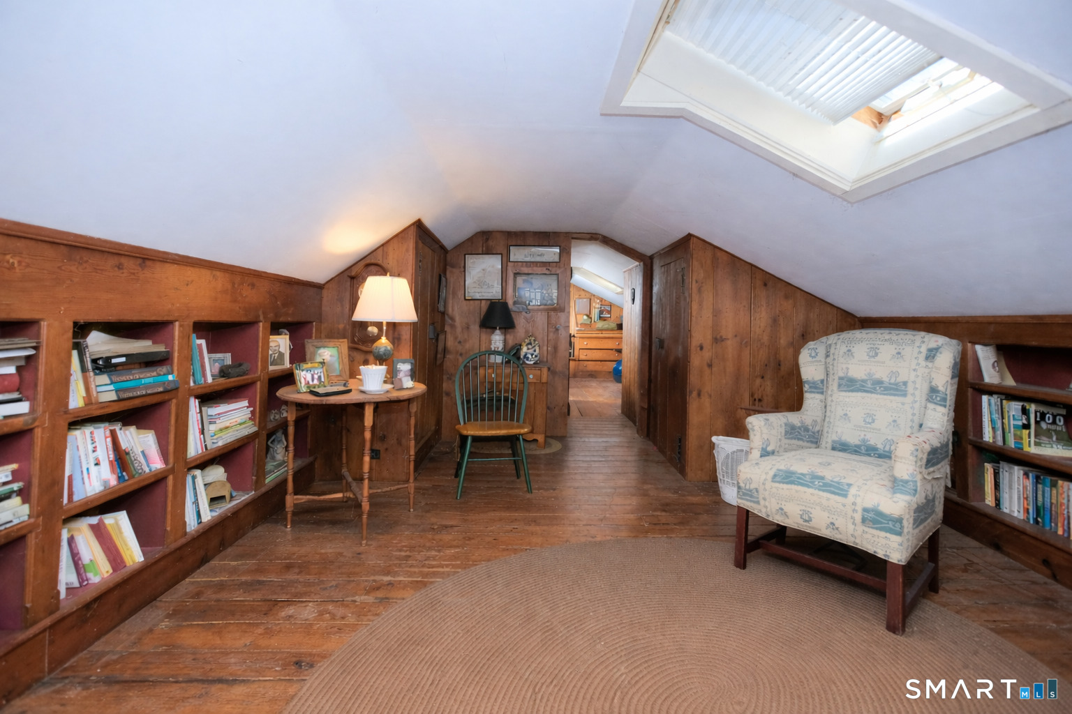 320 North Salem Road Ridgefield, CT 06877 - Photo 12 of 25 a living room with furniture and a book shelf