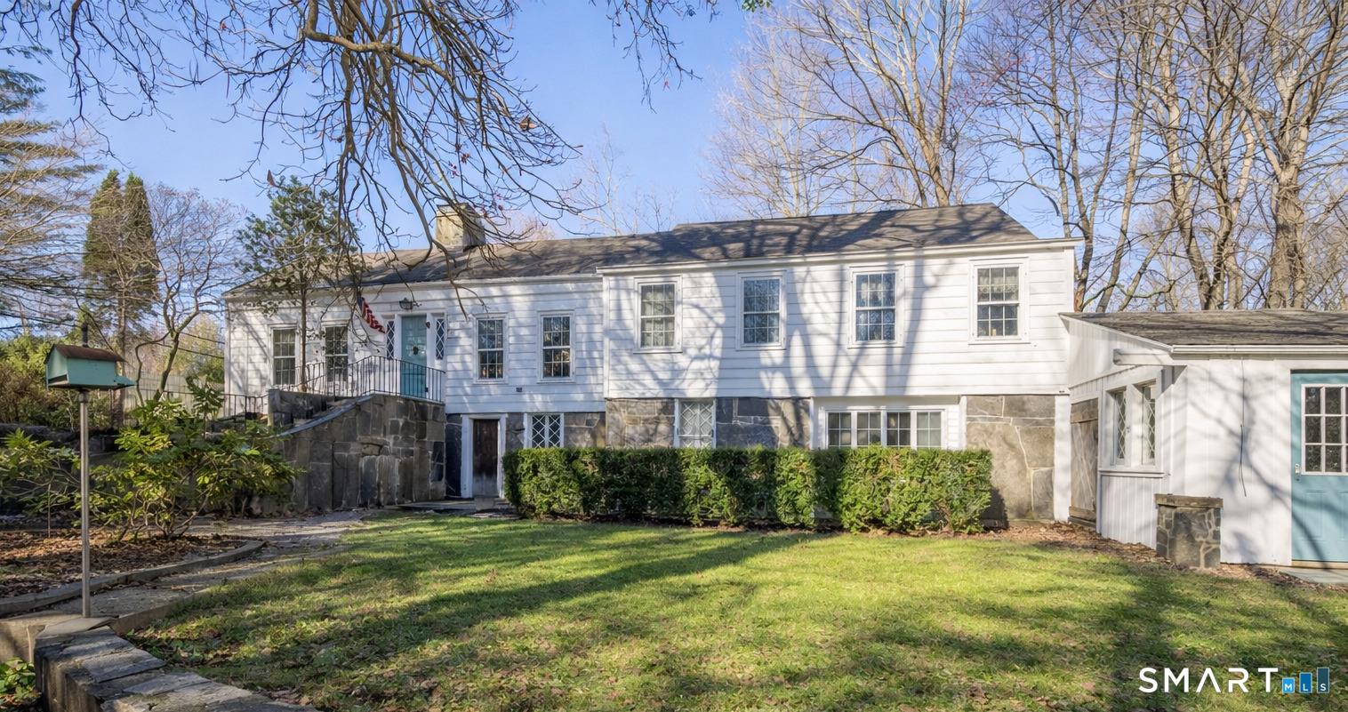 320 North Salem Road Ridgefield, CT 06877 - Photo 4 of 25 a front view of a building with a garden