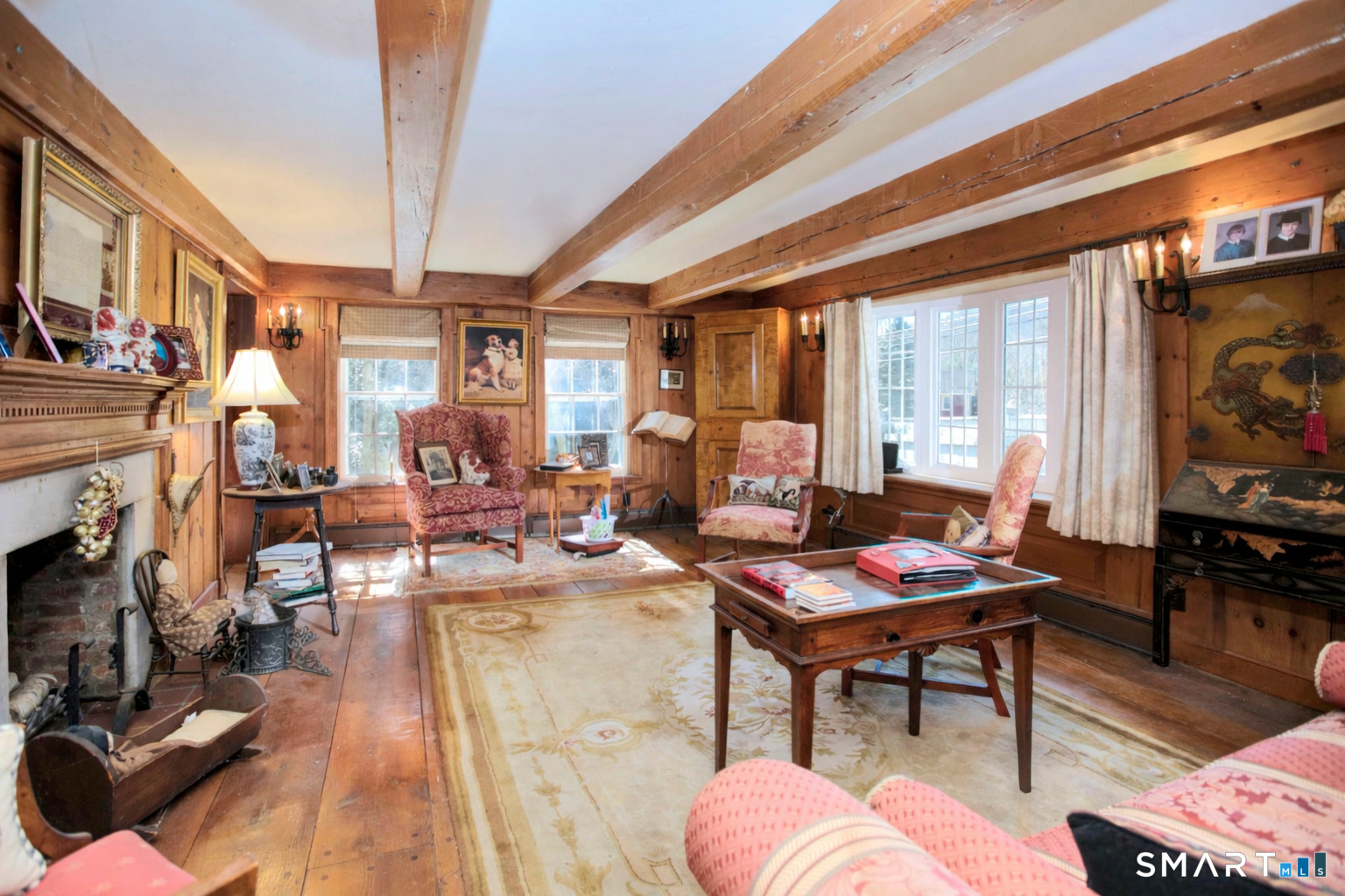 320 North Salem Road Ridgefield, CT 06877 - Photo 8 of 25 a living room with fireplace furniture and a flat screen tv