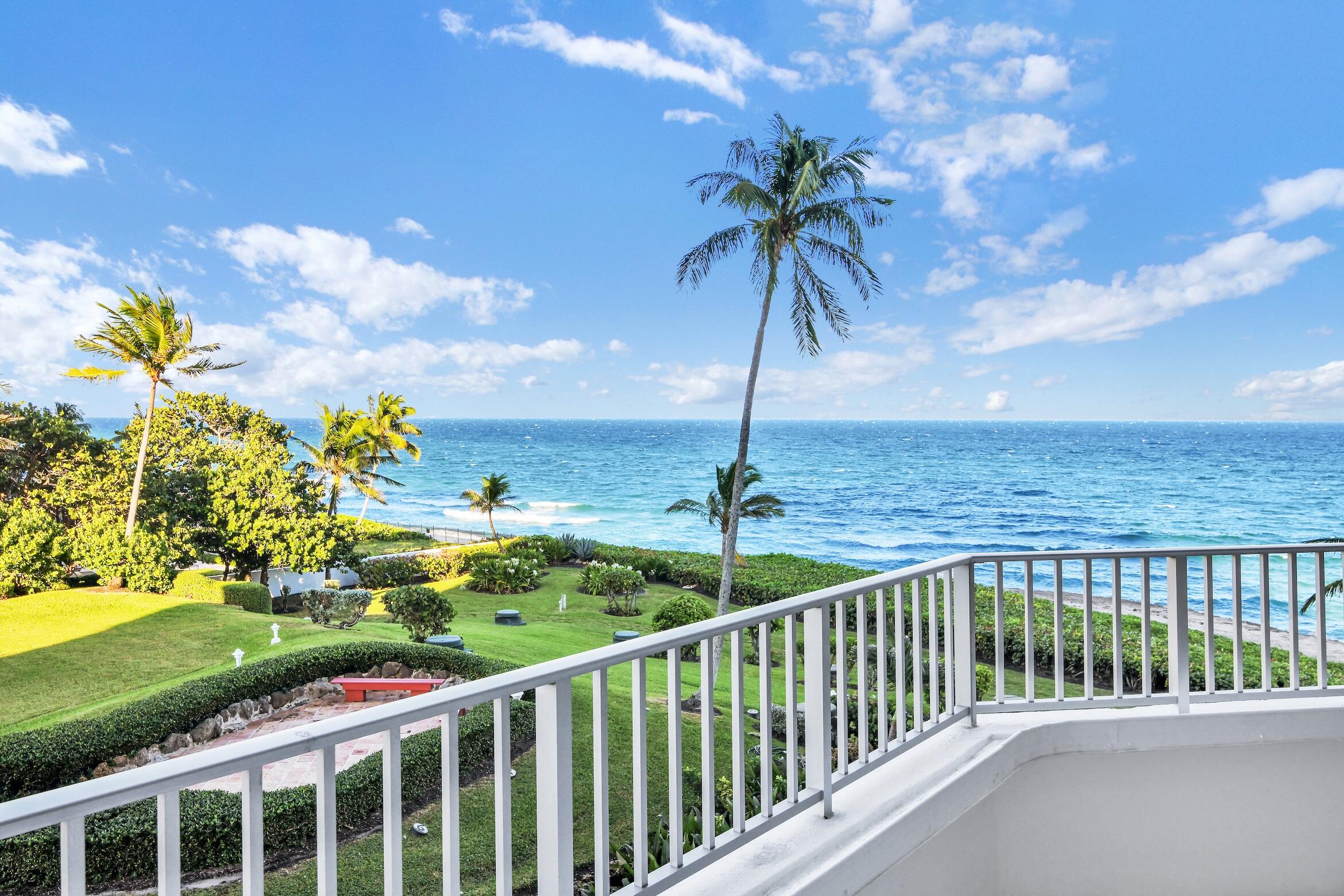 a view of a balcony with an ocean view