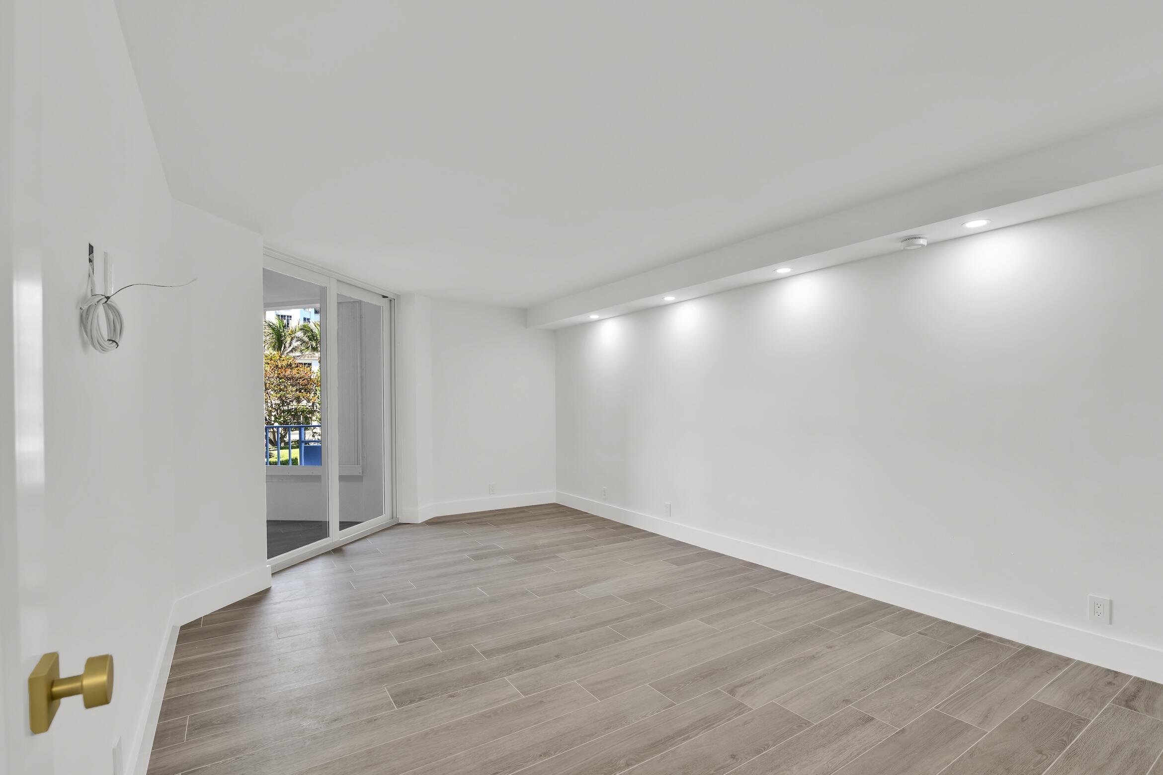 500 South Ocean Boulevard, Unit 303 Boca Raton, FL 33432 - Photo 13 of 46 an empty room with windows and closet