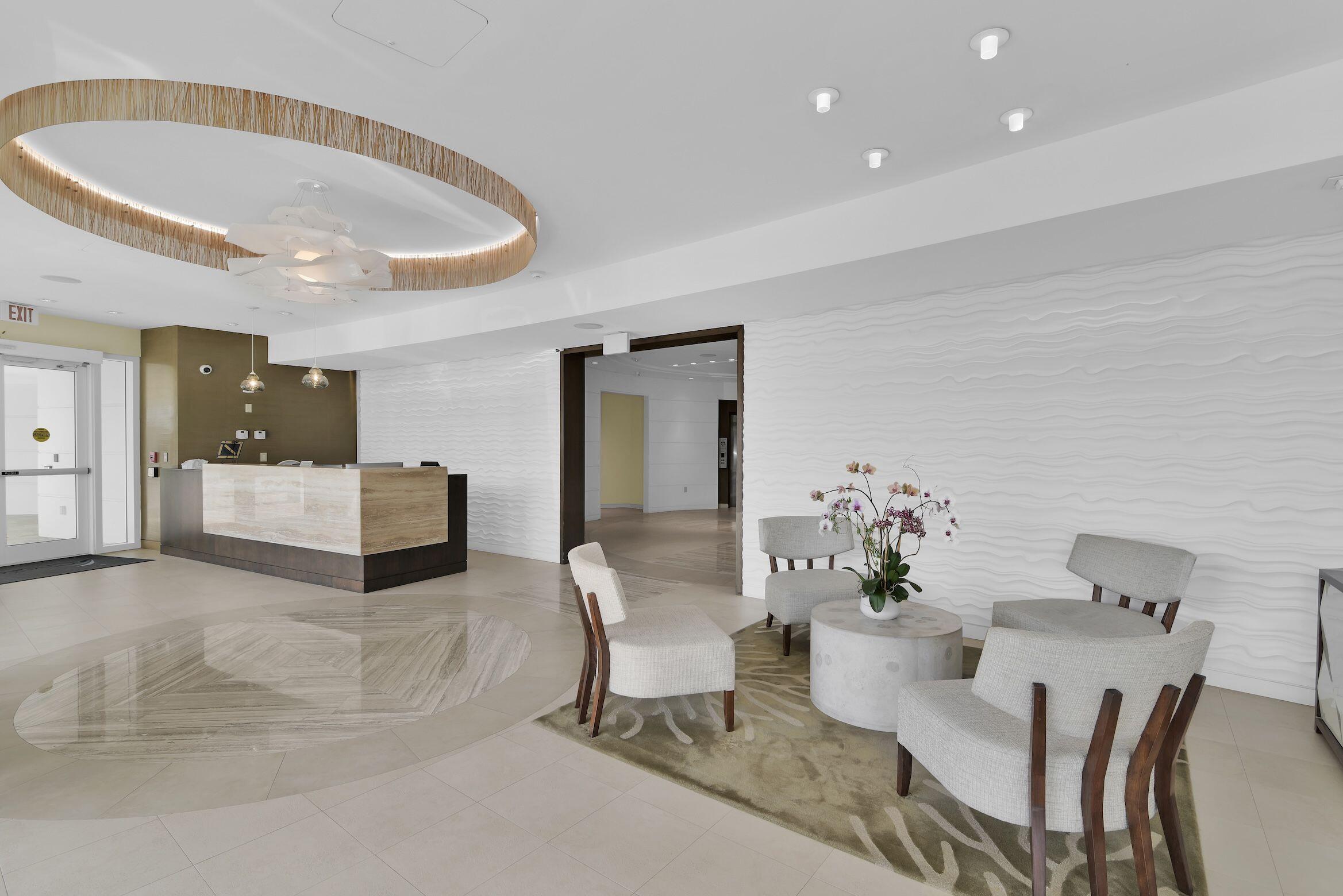 500 South Ocean Boulevard, Unit 303 Boca Raton, FL 33432 - Photo 27 of 46 a living room with furniture and kitchen view