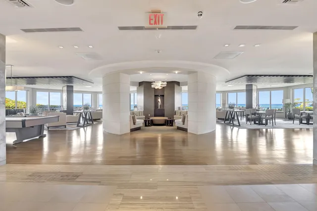 a view of pool table and chairs