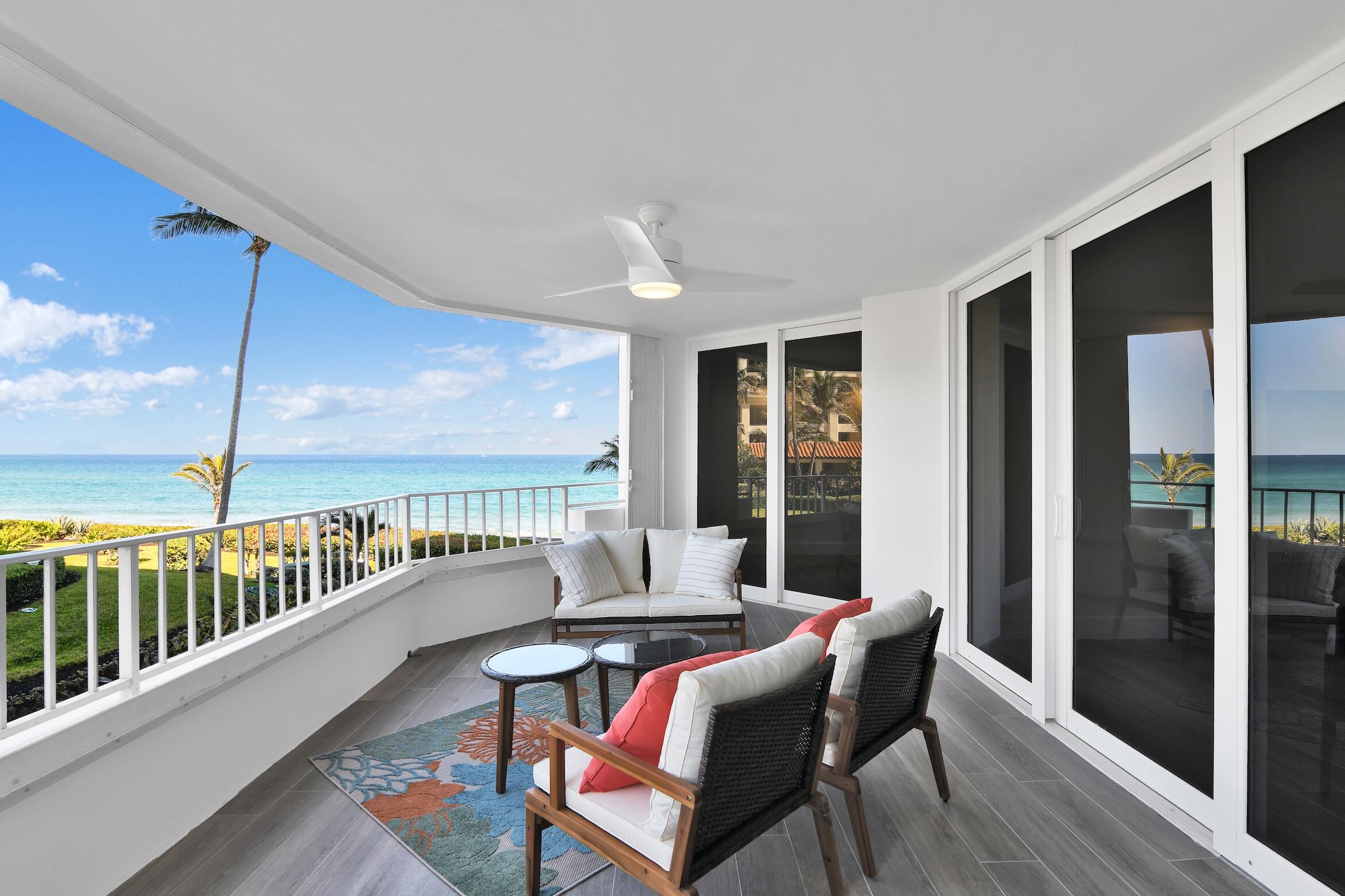 500 South Ocean Boulevard, Unit 303 Boca Raton, FL 33432 - Photo 3 of 46 a living room with furniture and a floor to ceiling window