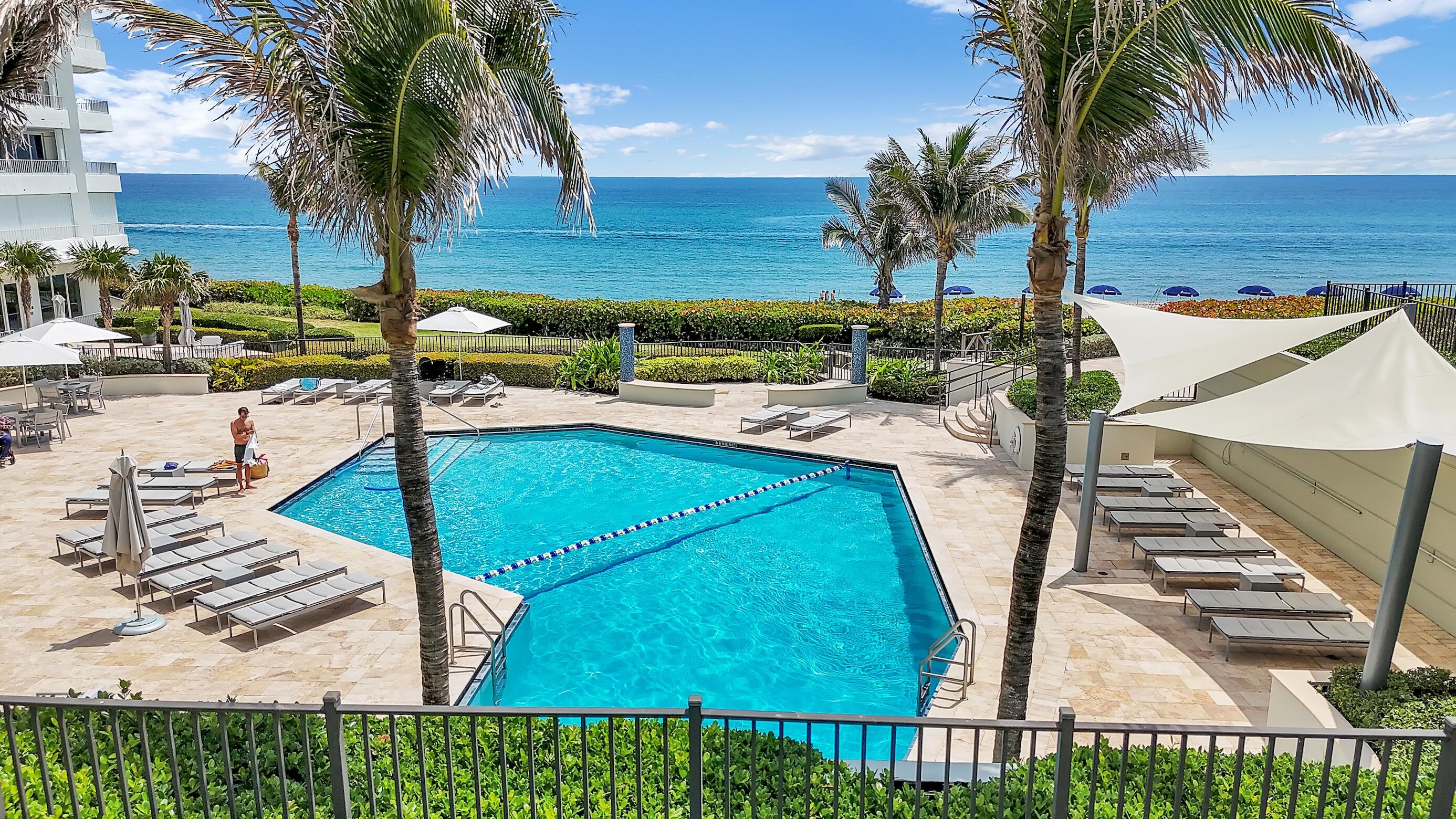 500 South Ocean Boulevard, Unit 303 Boca Raton, FL 33432 - Photo 35 of 46 swimming pool with chairs