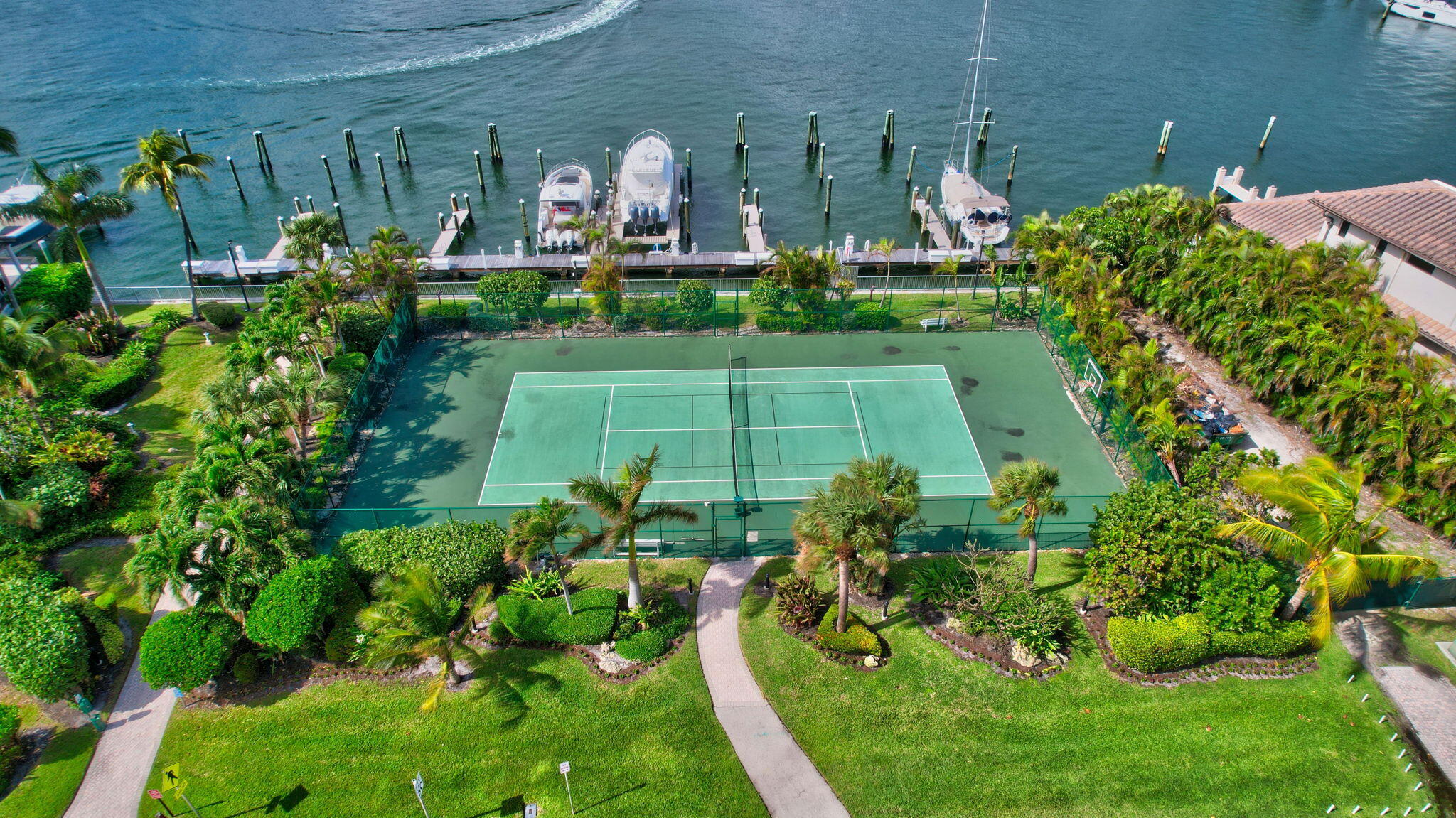 500 South Ocean Boulevard, Unit 303 Boca Raton, FL 33432 - Photo 38 of 46 a view of a house with a yard and potted plants