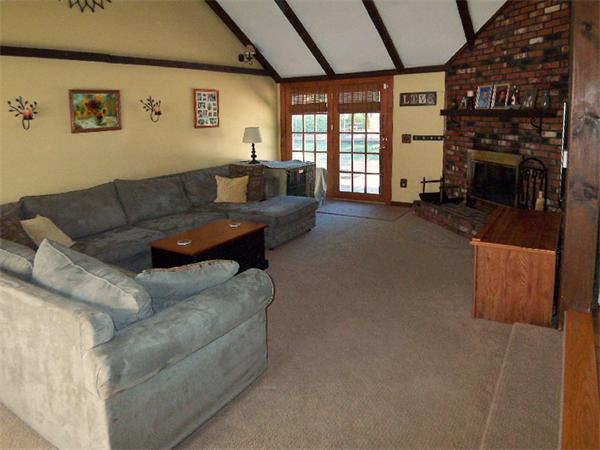212 Gage Road Athol, MA 01331 - Photo 3 of 9 a living room with furniture a fireplace and a large window