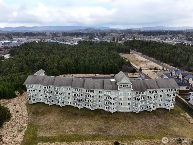 aerial view of a house with a yard